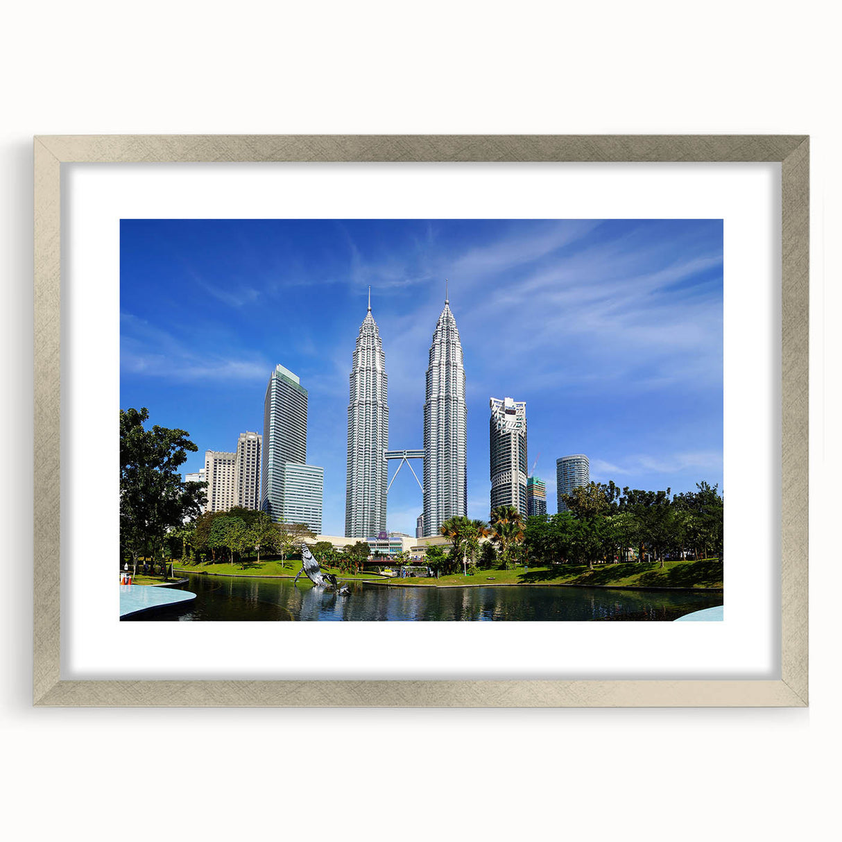 Textured abstract art print of a Malaysian landscape in muted earth tones on a silver-framed canvas.