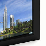 Close-up of textured black wall art featuring a vibrant Malaysian landscape on framed canvas, ideal for living room decor.