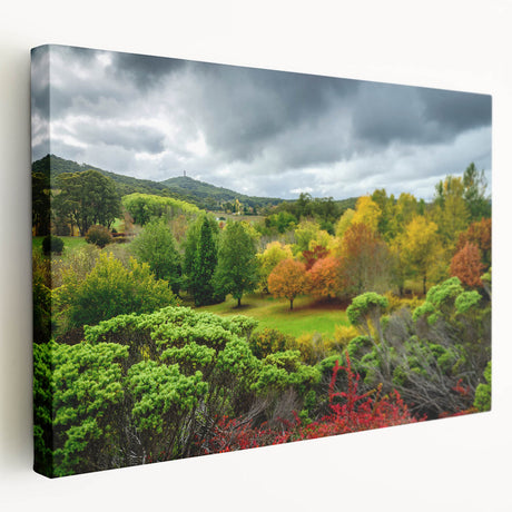 Side view of a stretched canvas depicting the Adelaide, Australia skyline in muted blue and green tones.