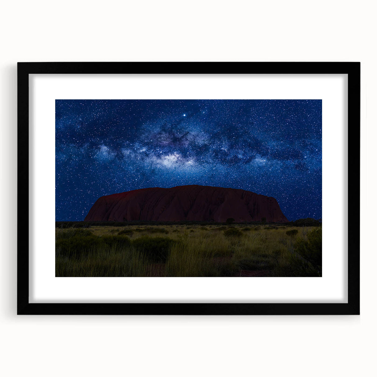 Extra large abstract art print of Ayers Rock in vibrant, textured colors on a framed black canvas.