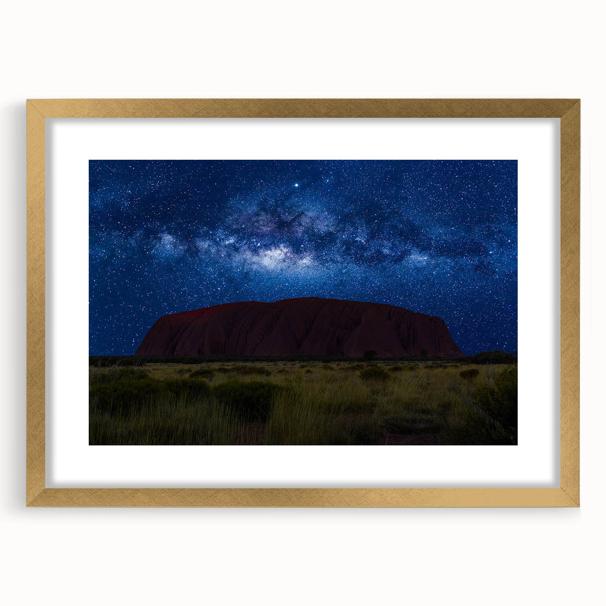 Textured art print of Ayers Rock in abstract style, with earthy tones on a framed gold mat, suitable for bedroom decor.