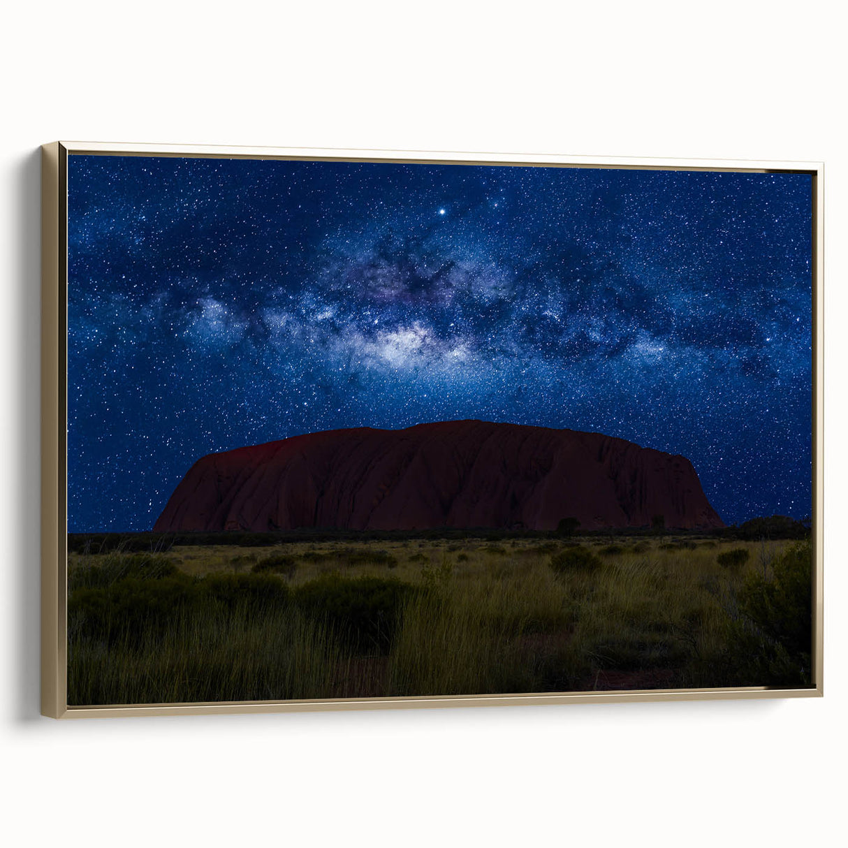 Framed canvas landscape art painting featuring Ayers Rock in Australia, with muted earth tones, ideal for living room decor.