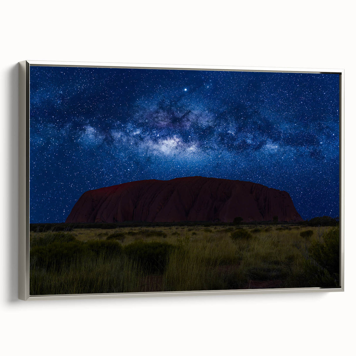 Vintage poster art of Ayers Rock in vibrant colors on a silver-framed canvas, ideal for extra large living room wall decor.