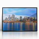 Large abstract wall art depicting the Sydney skyline in muted gray and blue tones on a framed acrylic print.
