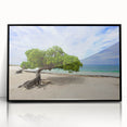 Large abstract wall art depicting the Caribbean Aruba scenery in vibrant blue and green hues, framed in black acrylic.