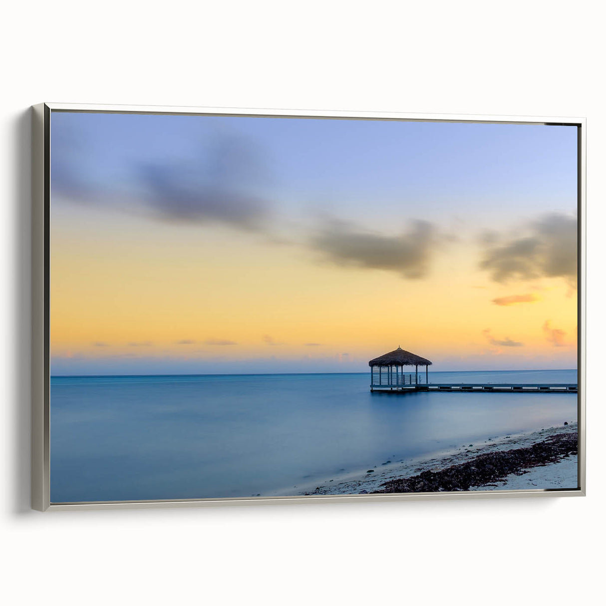 Framed canvas wall art depicting a serene Caribbean landscape in muted blues and greens, ideal for bedroom decor.