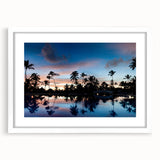 Textured abstract art print depicting a Caribbean scenery in vibrant blue and green tones, framed with a white mat.