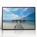 Large abstract wall art depicting a Caribbean Martinique scenery in muted green and blue tones, framed in black acrylic.