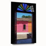 Large abstract wall art of a Central American scenery in vibrant blue and green hues on acrylic glass.