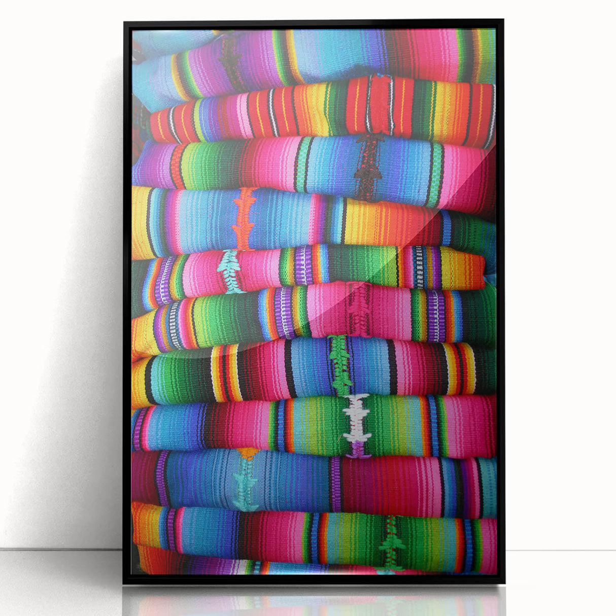 Large abstract wall art of a Central American landscape in muted earth tones, framed in black acrylic.