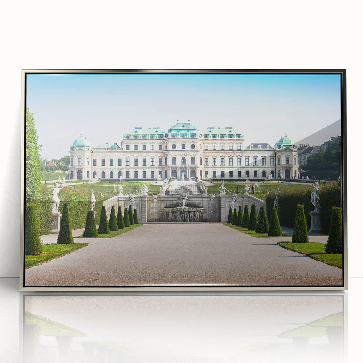 Large art print of a serene Austrian landscape in muted green and blue tones, framed in silver acrylic.