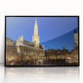 Large abstract wall art depicting a European scenery in muted earth tones, framed in black acrylic.