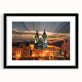 Abstract art print of a colorful European cityscape in vibrant hues, framed in black, ideal for living room decor.