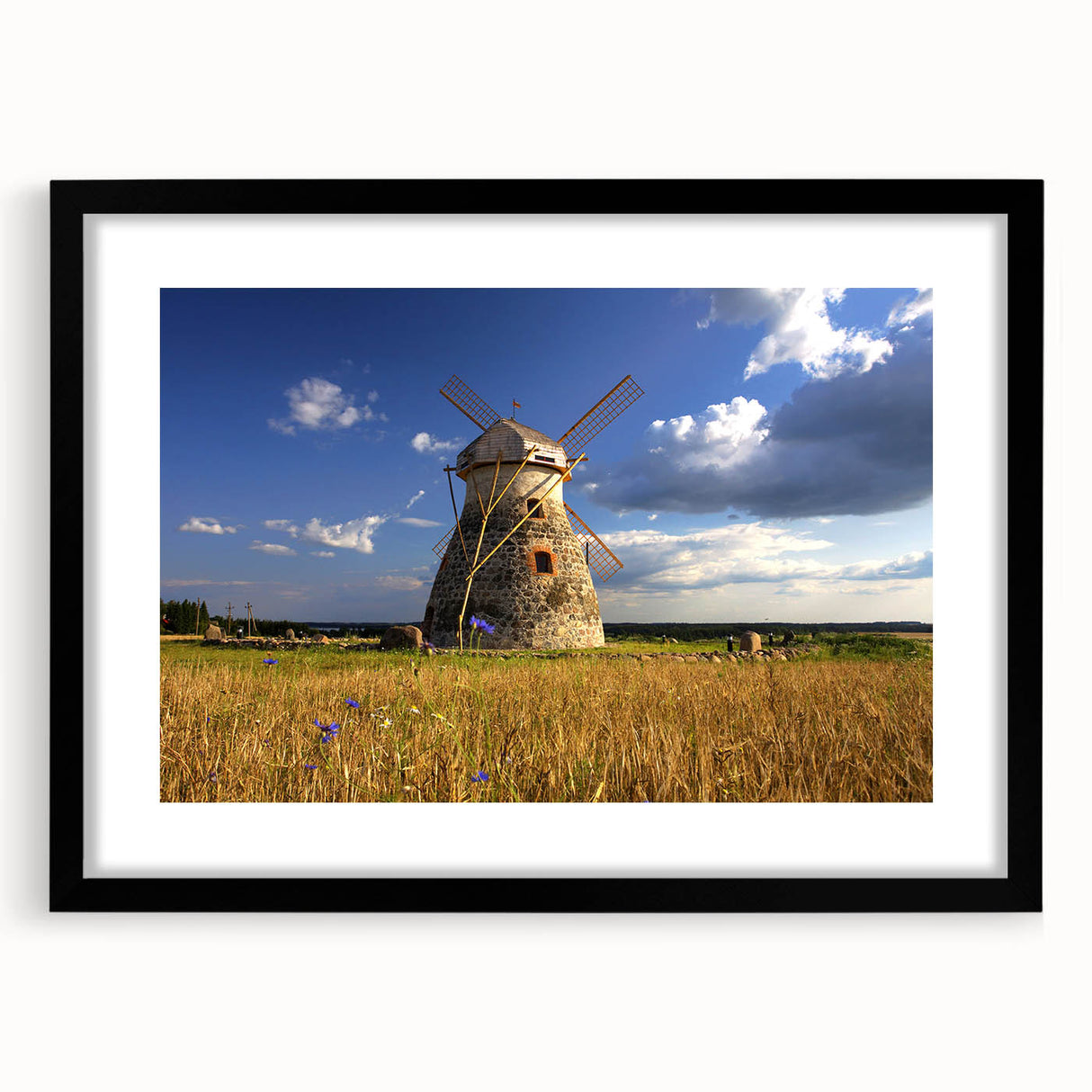 Extra large abstract art print of a colorful European scenery on textured canvas, framed in black.