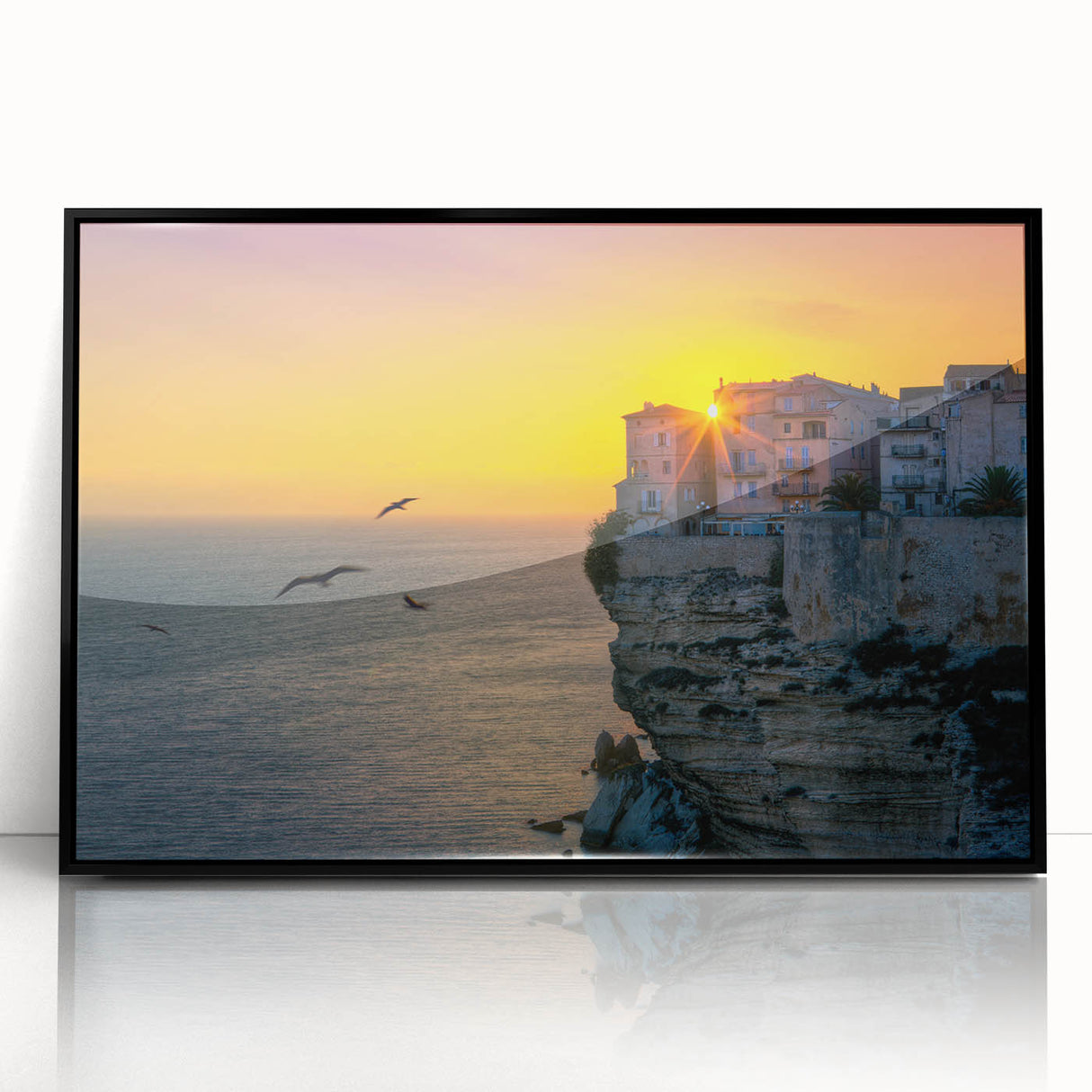 Large abstract wall art depicting a coastal Corsican landscape in muted blue and green tones, framed in black acrylic.