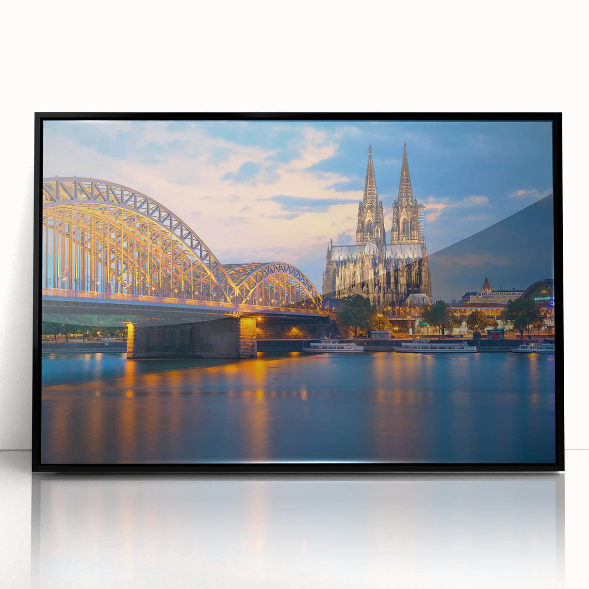 Large abstract wall art depicting a stylized European cityscape in muted gray and blue tones, framed in black acrylic.
