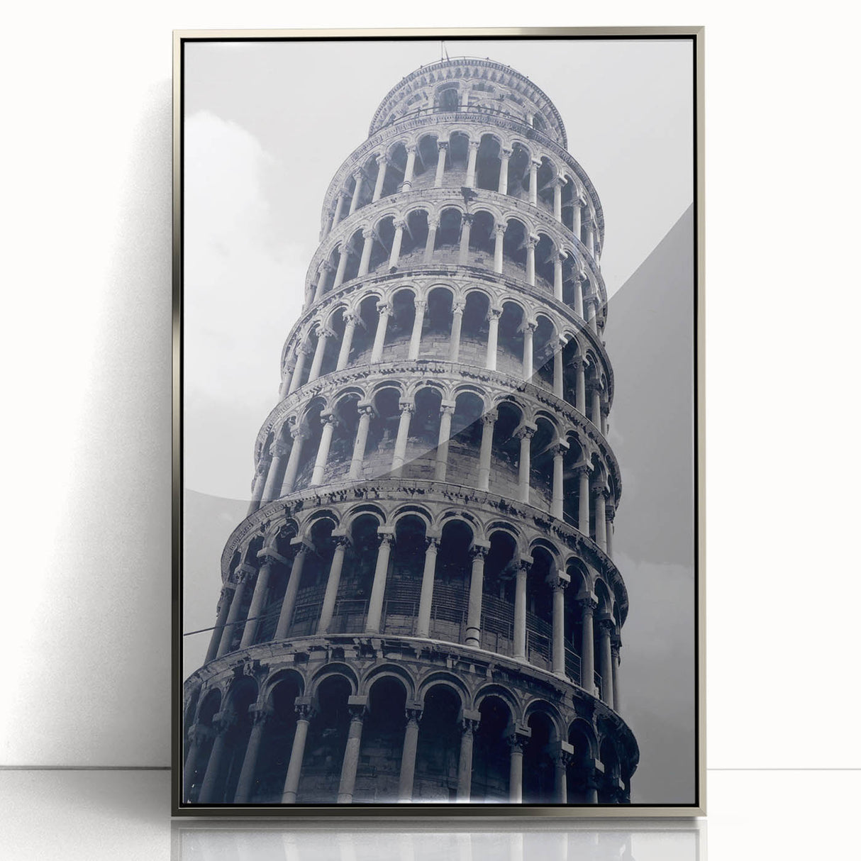 Acrylic print of the Leaning Tower of Pisa in muted earth tones, framed in silver, ideal for modern art wall decor.