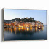 Framed canvas landscape art painting of Portofino, Italy, featuring colorful houses and a serene sea, set in a silver frame.