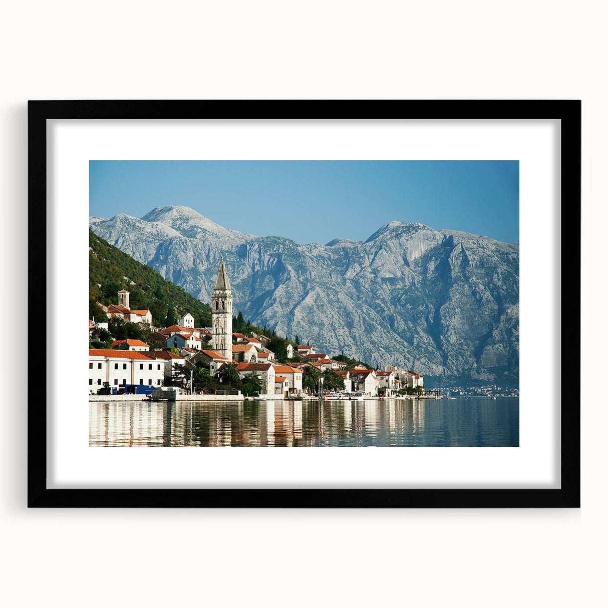 Colorful abstract art print of a European scenery in Montenegro, displayed in a black frame with mat.