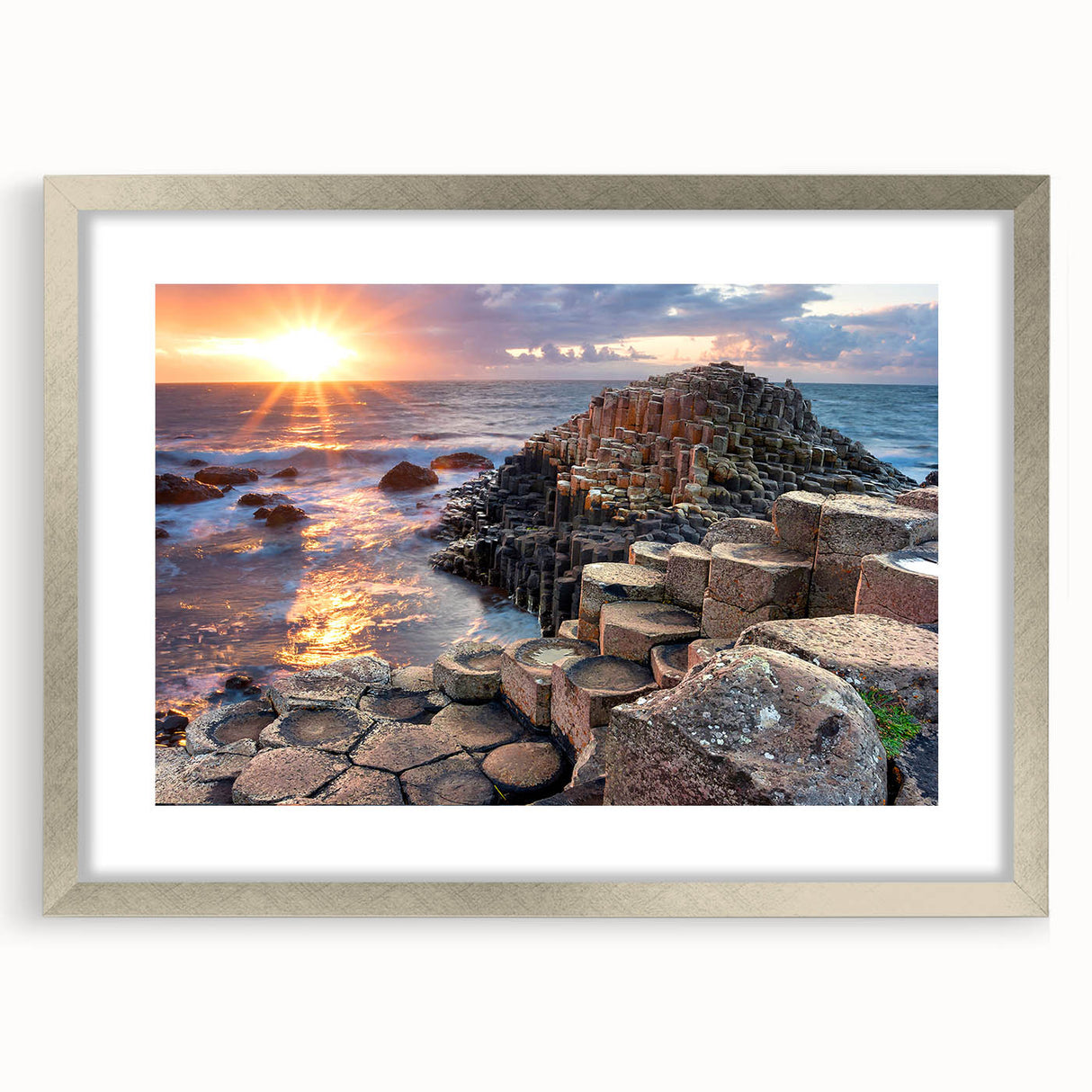 Extra large abstract art print of a Northern Ireland scenery in muted green and blue tones, framed in silver.