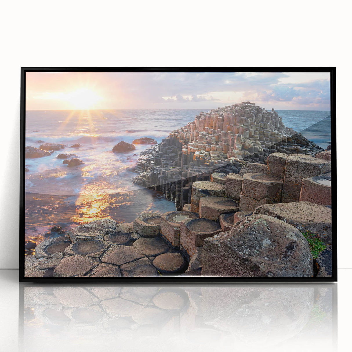 Large abstract wall art depicting a Northern Ireland scenery in muted green and blue tones, framed in black acrylic.