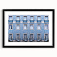 Colorful abstract art print of Lisbon scenery in vibrant hues on a large textured canvas, framed in black.