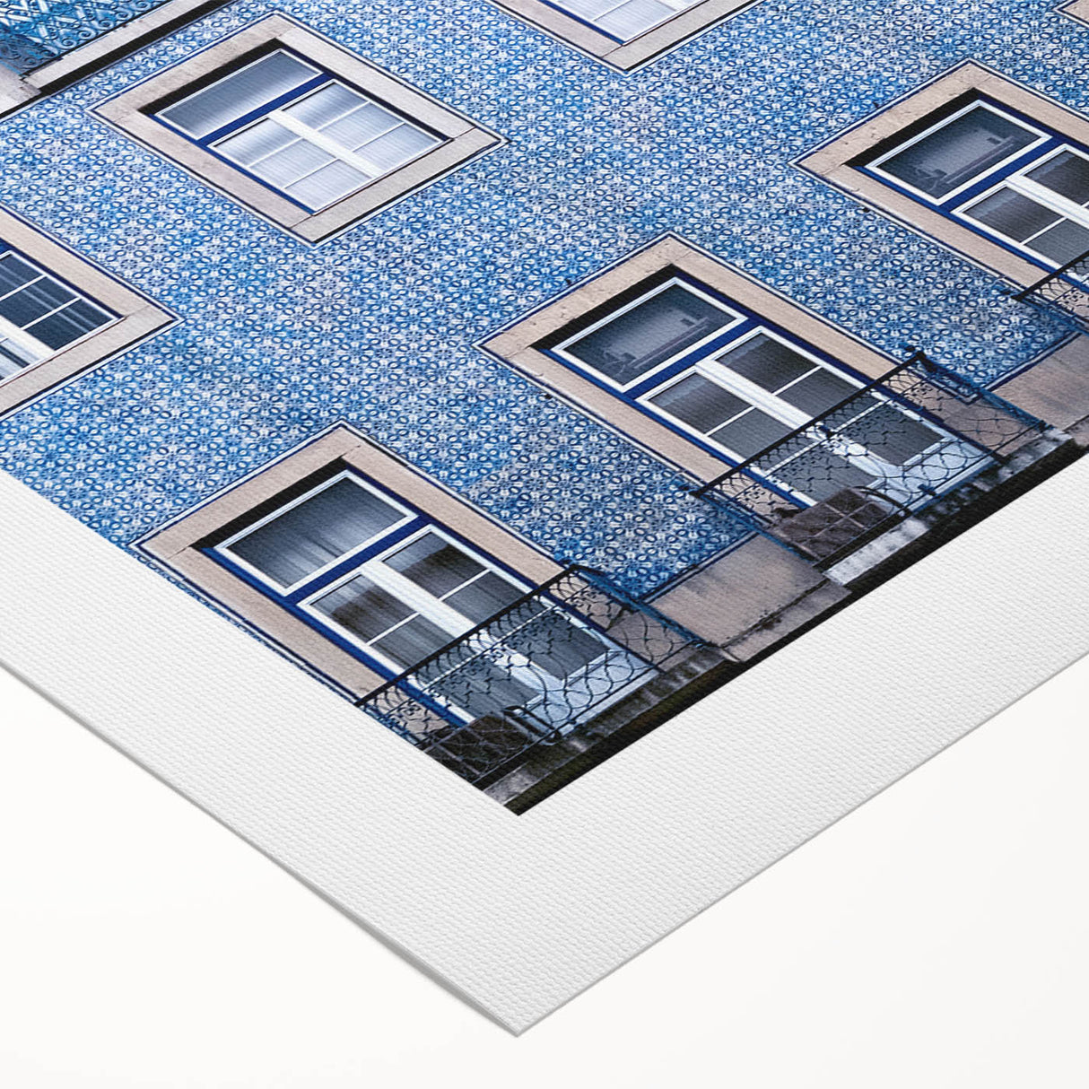 Art deco poster of Lisbon scenery in muted blue and white tones on rolled canvas, suitable for dining room wall art.