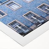 Art deco poster of Lisbon scenery in muted blue and white tones on rolled canvas, suitable for dining room wall art.