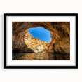 Abstract art print of a colorful European scenery in vibrant hues on a large, textured canvas, framed in black.