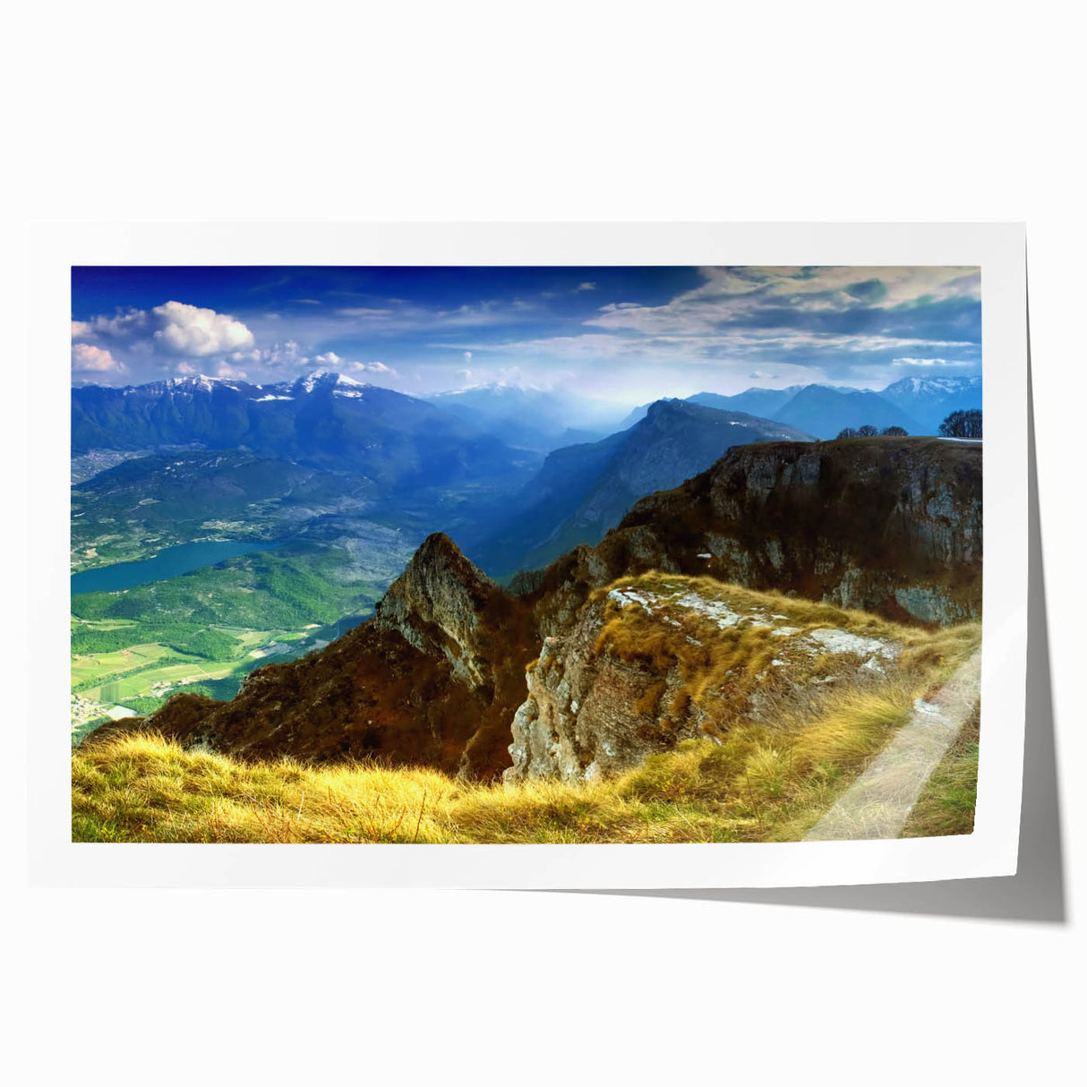 Rolled print of a Romanian landscape featuring lush greenery and a distant castle, in soft earth tones.