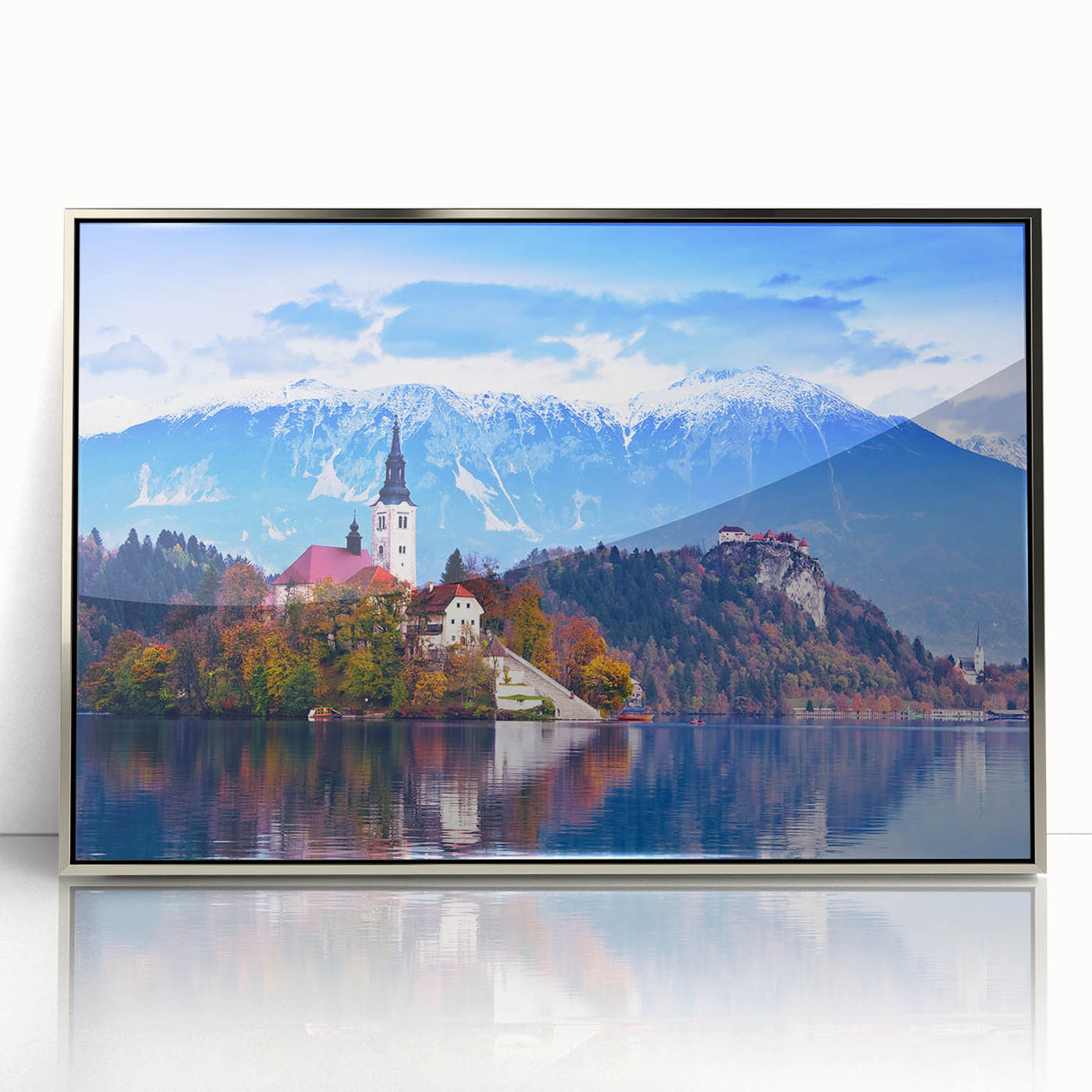 Acrylic print of a scenic Slovenian landscape in muted green and blue tones, framed in silver.