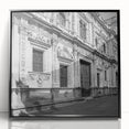 Large abstract wall art depicting a stylized Barcelona cityscape in muted earth tones, framed in black acrylic.