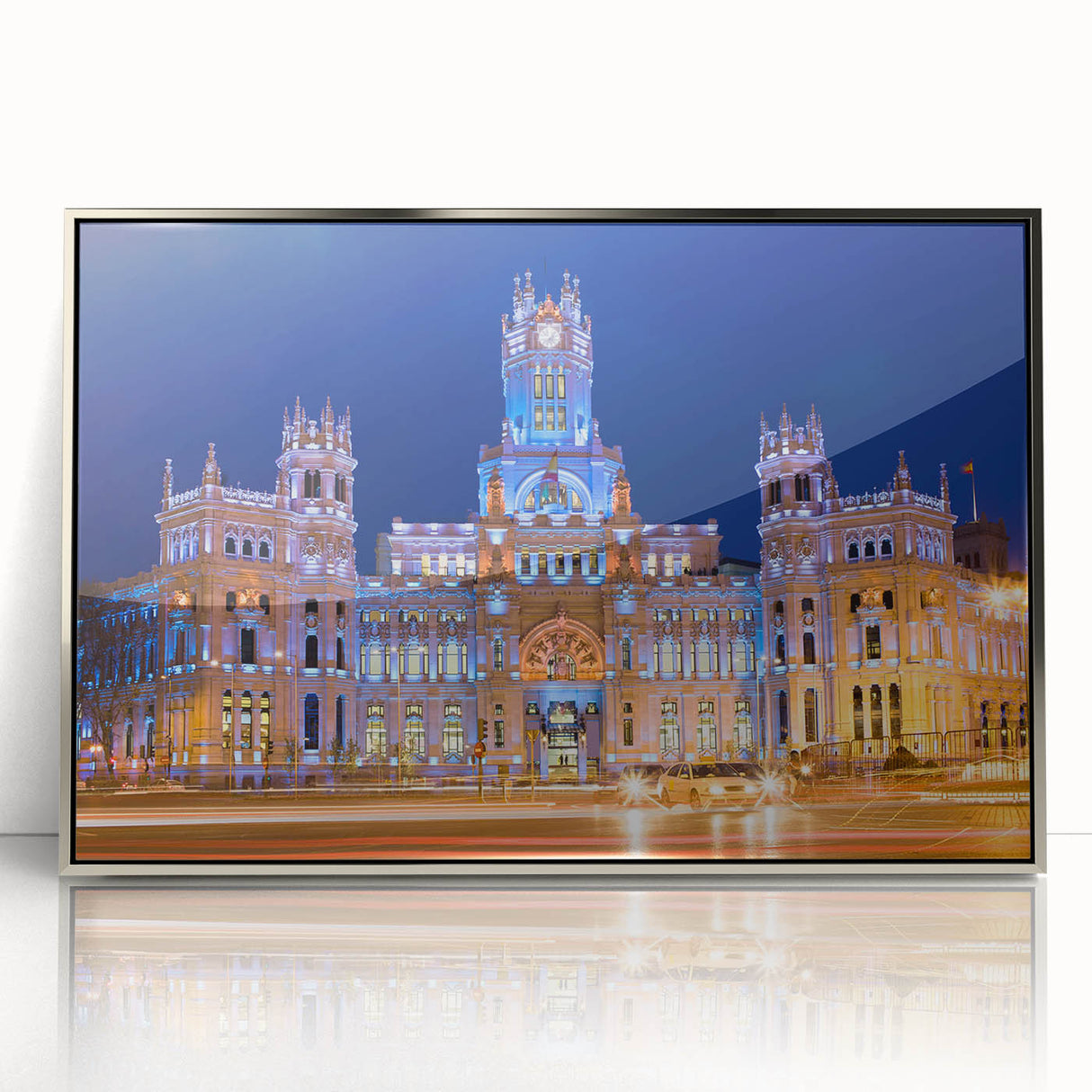 Mid-century modernist art depicting Madrid's skyline in muted earth tones on a silver-framed acrylic print.