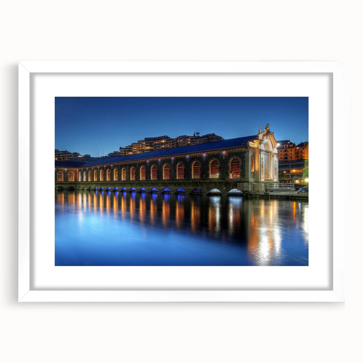 Abstract art print of Geneva scenery in muted blue and green tones on a white framed canvas, ideal for dining room decor.