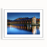 Abstract art print of Geneva scenery in muted blue and green tones on a white framed canvas, ideal for dining room decor.