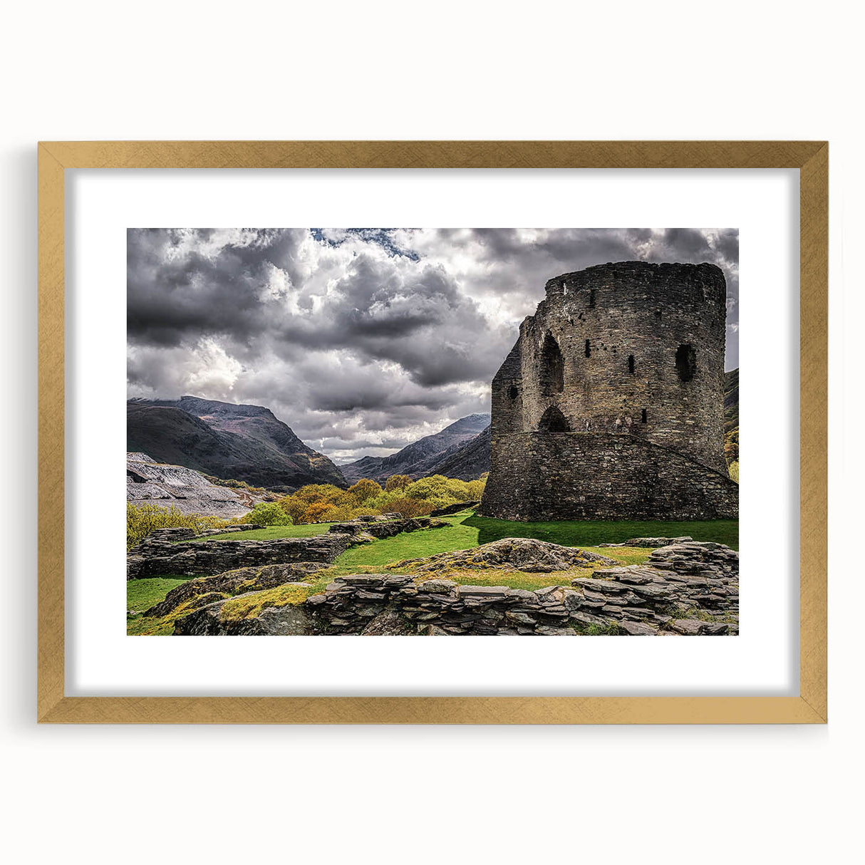 Extra large abstract art print of a scenic Welsh landscape in muted green and blue tones, framed in gold.