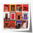 Rolled print of Guanajuato, Mexico, featuring vibrant color palette and floral elements, ideal for art wall dining room.
