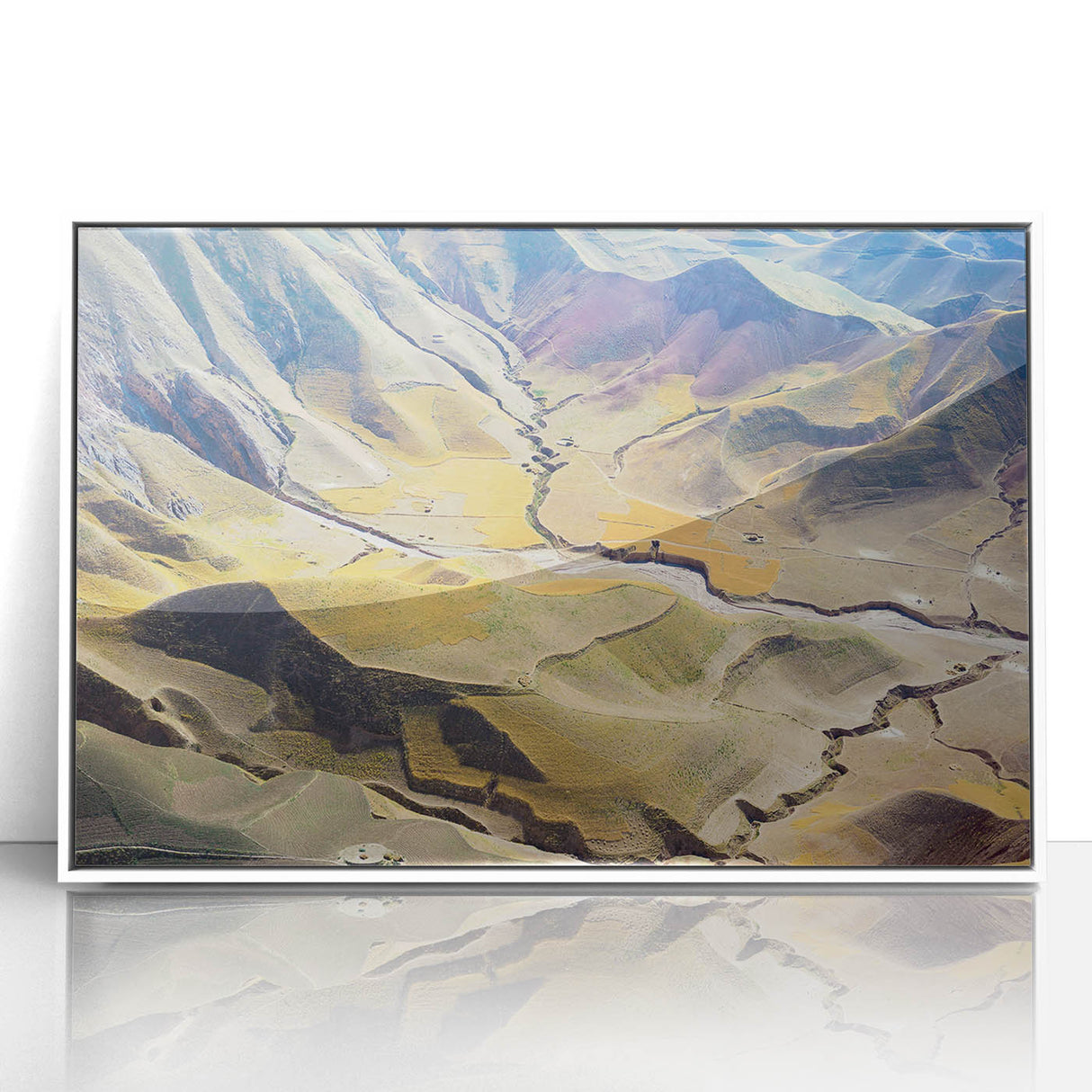 Acrylic print of a Middle Eastern desert scene in muted earth tones, framed in white, suitable for modern art wall decor.