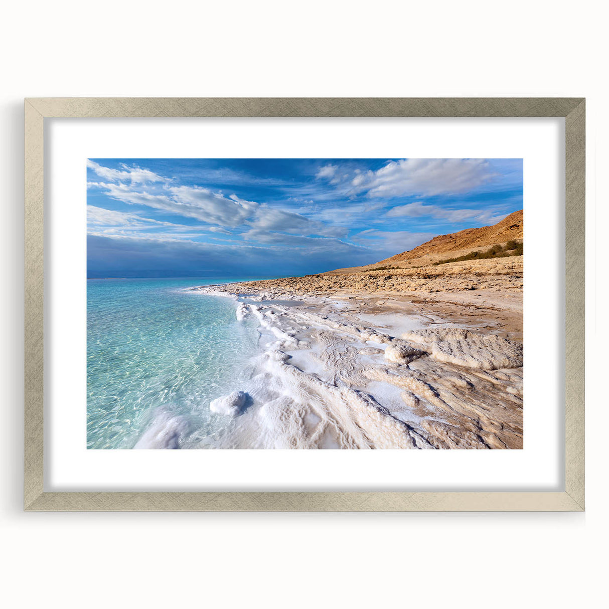 Textured abstract art print of the Dead Sea in muted blues and grays, framed in silver, ideal for bedroom art.