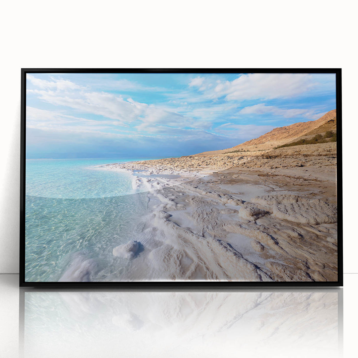 Large abstract wall art depicting the Dead Sea in muted blue and gray tones, framed in black acrylic.