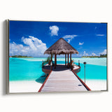 Landscape art painting of Bora Bora with vibrant blue waters and lush greenery on a silver-framed canvas.