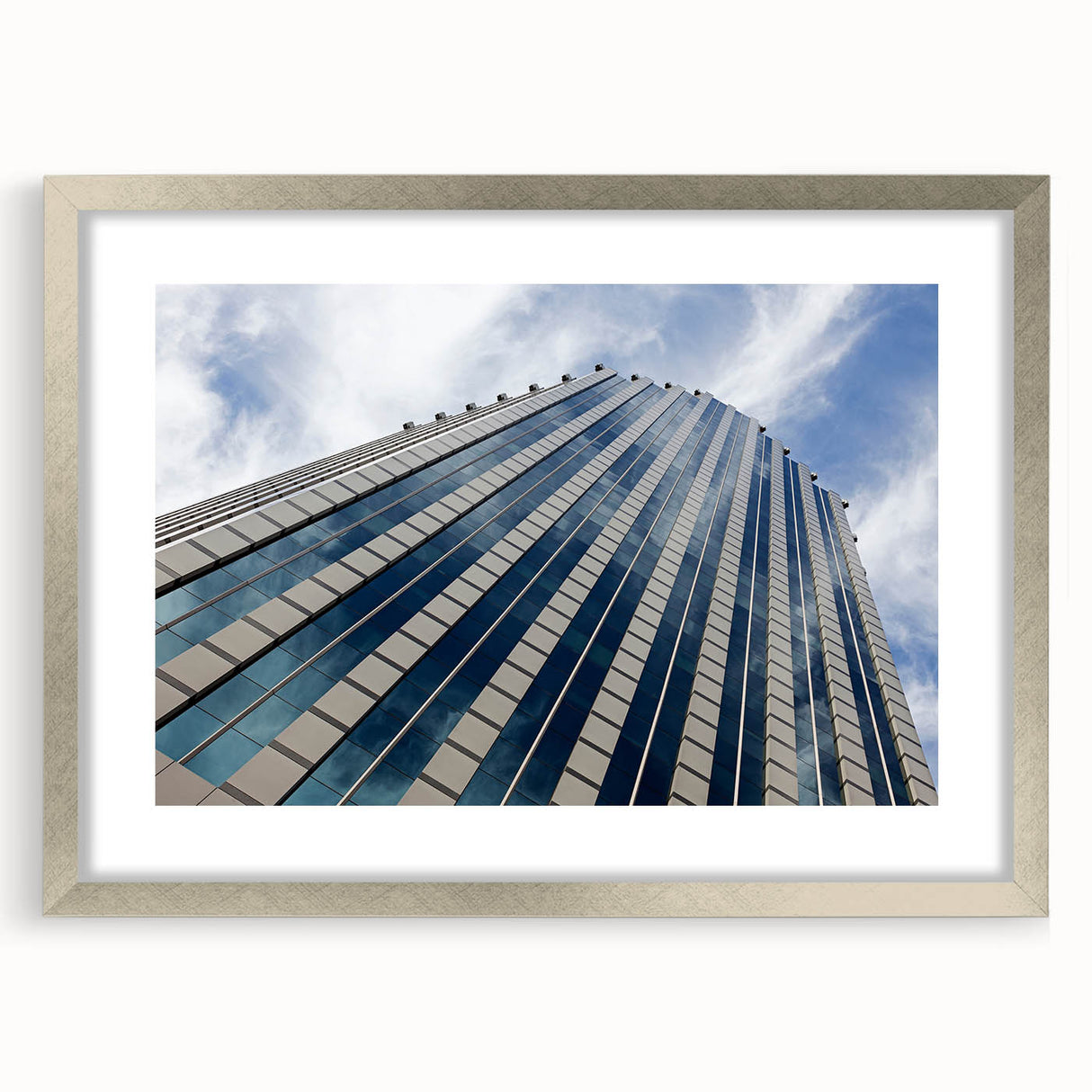 Textured art of abstract Santiago skyline in muted earth tones on a framed silver mat, suitable for bedroom decor.
