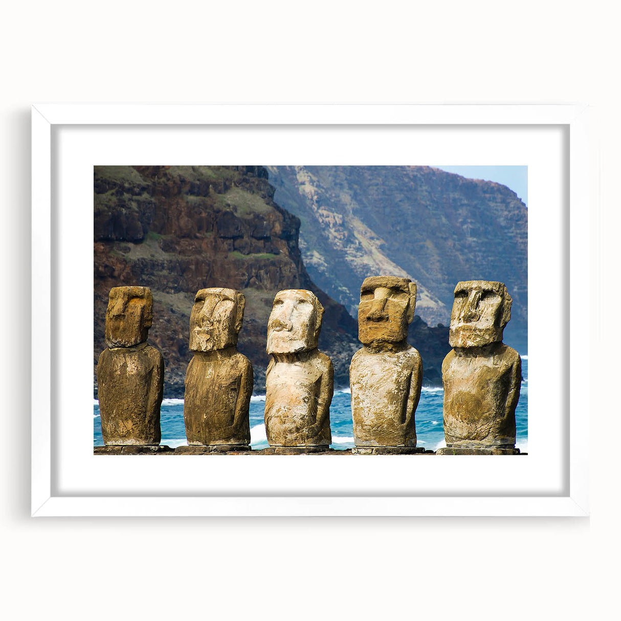 Abstract art print of Easter Island statues in muted earth tones on a white-framed mat, suitable for dining room decor.