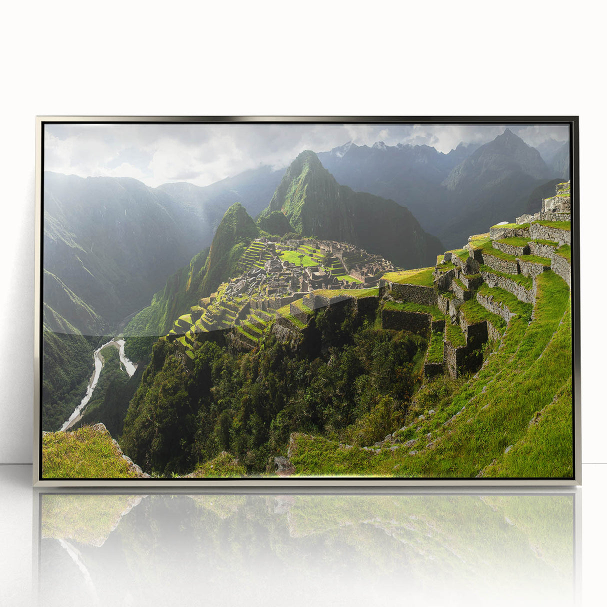 Mid-century modernist art of Machu Picchu in muted earth tones on a silver-framed acrylic print.