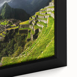 Framed canvas of Machu Picchu in textured black with colorful elements, ideal for living room decor.