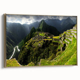 Framed canvas wall art featuring a vintage-style landscape painting of Machu Picchu in muted gold and black tones.