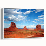 Vintage poster art of Monument Valley in Arizona on a framed canvas, featuring earth tones, ideal for living room decor.