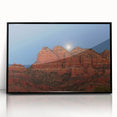 Large abstract wall art depicting the Sedona landscape in vibrant red and orange tones, framed in black acrylic.