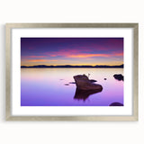 Textured art of Lake Tahoe in abstract style, with muted blue and green tones on a silver-framed mat, ideal for bedroom art.