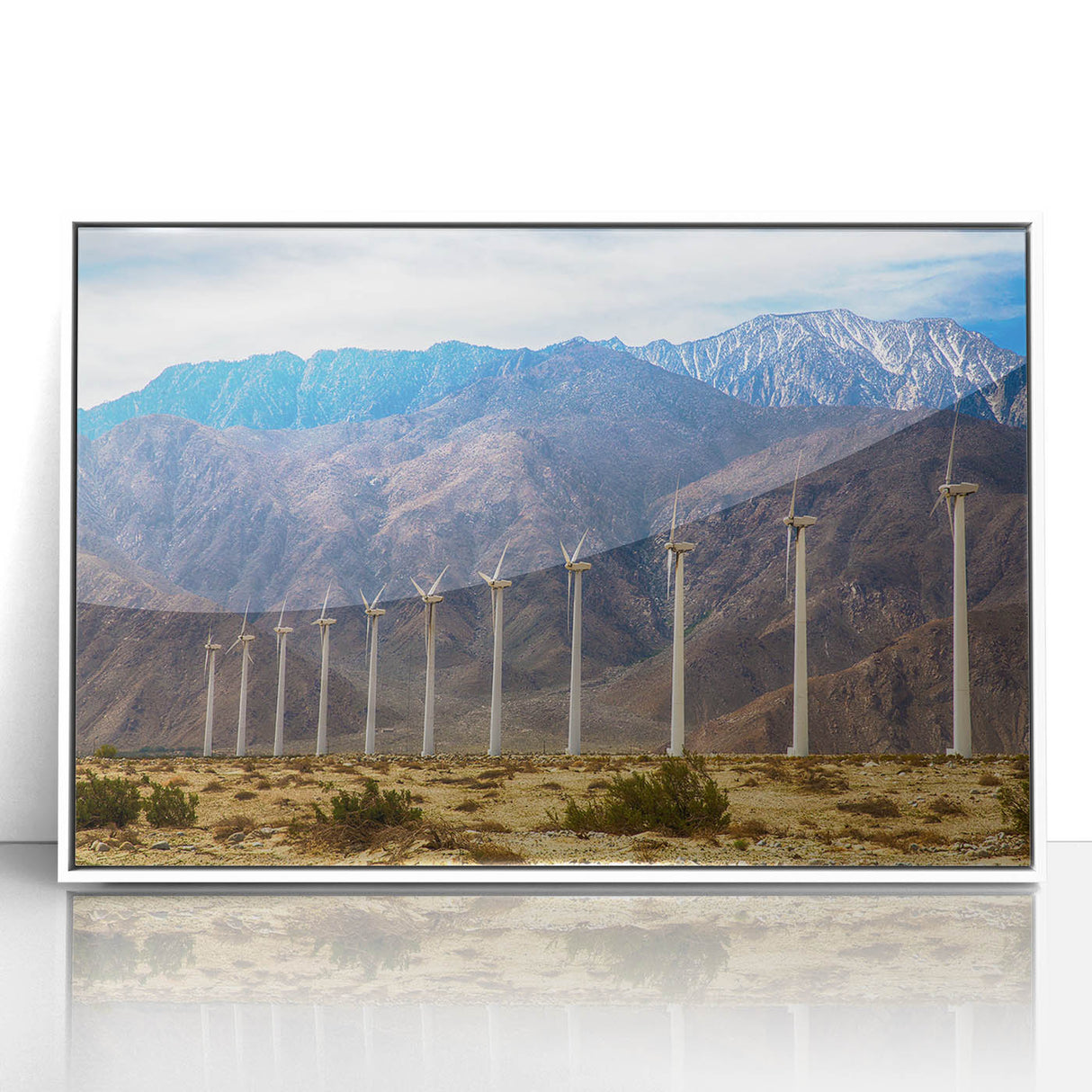 Art deco poster featuring a Palm Springs landscape in pastel shades on a white-framed acrylic.